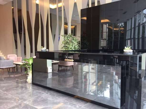 Imagen de los interiores del Hotel Excellence Inn. Foto 19