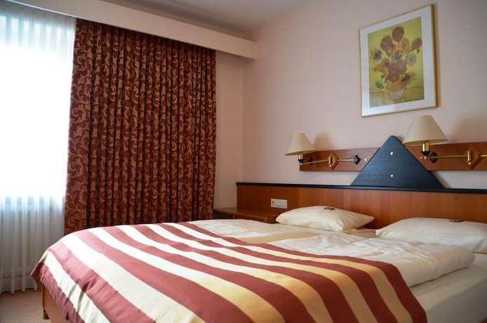 Imagen de la habitación del Hotel Exquisit. Foto 9