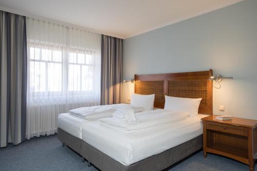 Imagen de la habitación del Hotel GODEWIND. Foto 14