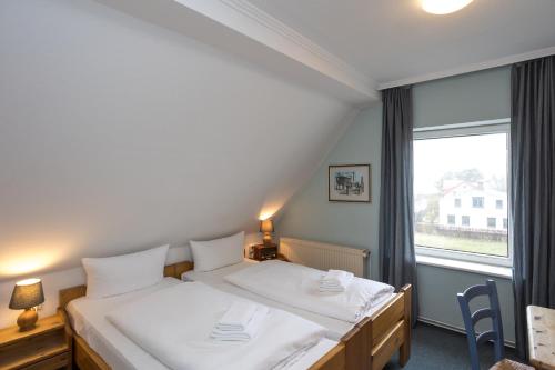 Imagen de la habitación del Hotel GODEWIND. Foto 16