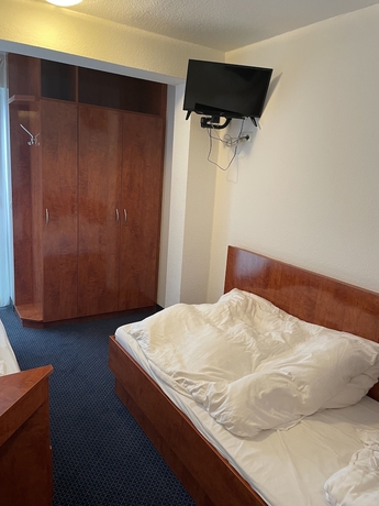 Imagen de la habitación del Hotel Garni Merkenich. Foto 13