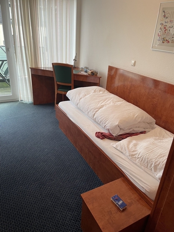 Imagen de la habitación del Hotel Garni Merkenich. Foto 14