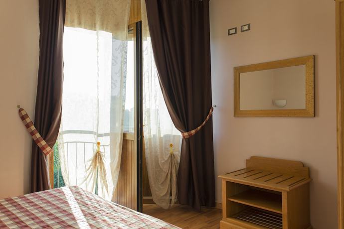 Imagen de la habitación del Hotel Il Giardino. Foto 15