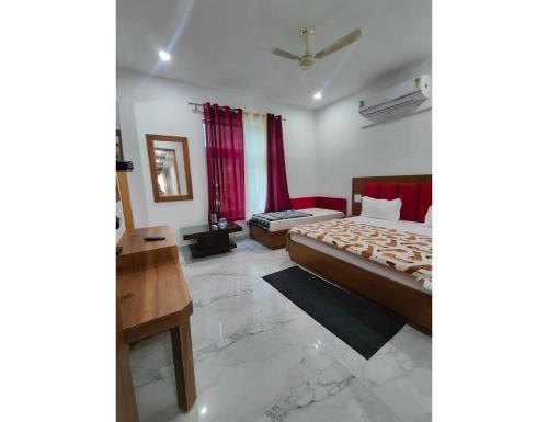 Imagen de la habitación del Hotel Jahnavi , Uttarkashi. Foto 9