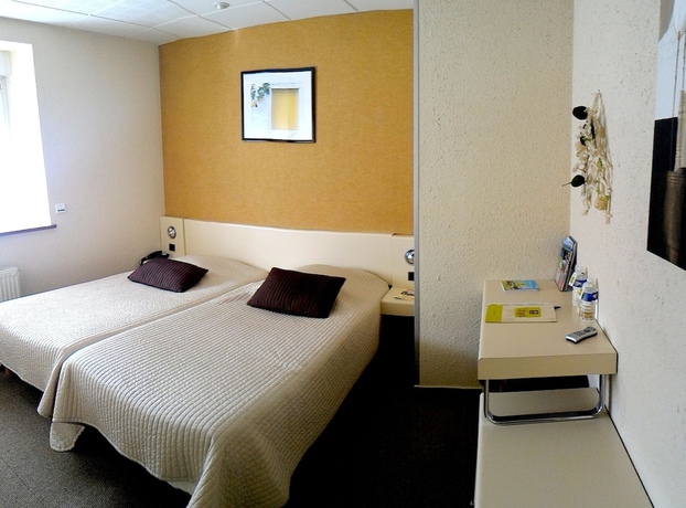 Imagen de la habitación del Hotel L Arcombelle. Foto 13