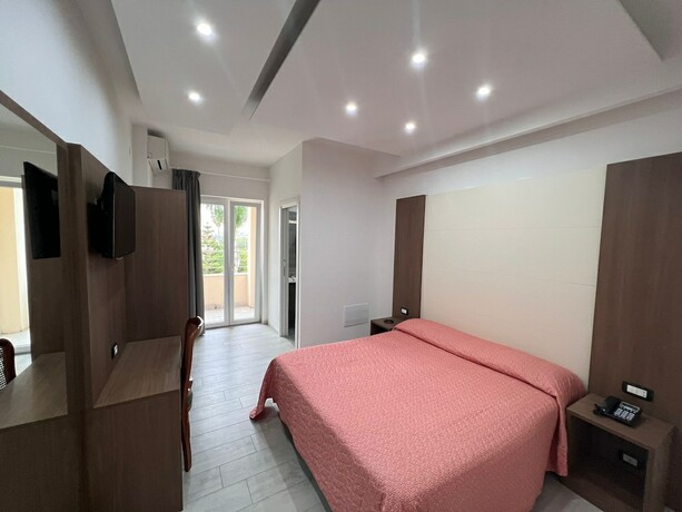 Imagen de la habitación del Hotel La Mela. Foto 15