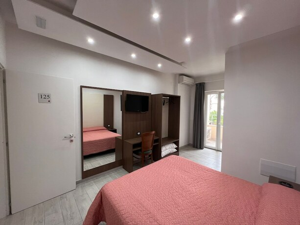 Imagen de la habitación del Hotel La Mela. Foto 16