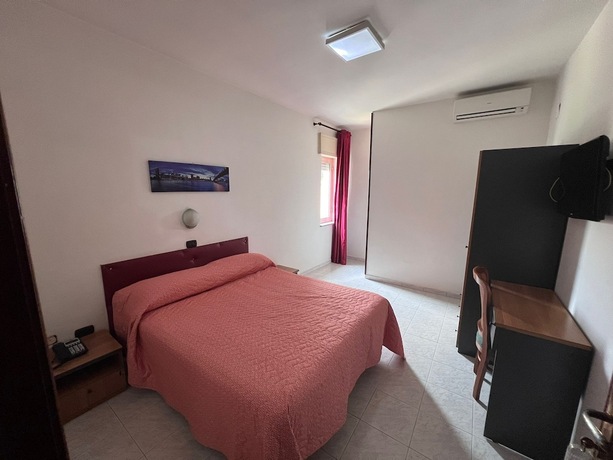 Imagen de la habitación del Hotel La Mela. Foto 19