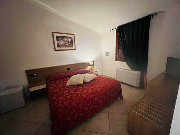 Imagen de la habitación del Hotel Le Corti. Foto 12