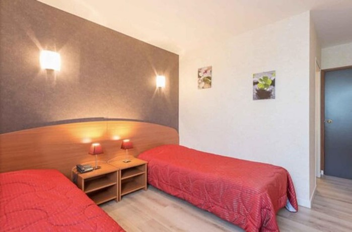 Imagen de la habitación del Hotel Les Trois Marchands. Foto 5