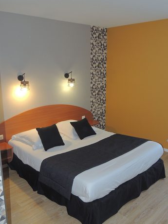 Imagen de la habitación del Hotel Les Trois Marchands. Foto 7