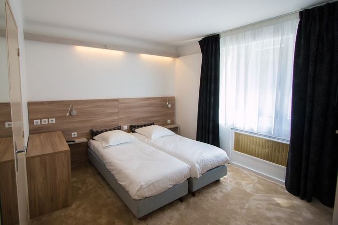 Imagen de la habitación del Hotel Les Voyageurs. Foto 4