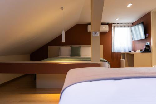 Imagen de la habitación del Hotel Ma Belle. Foto 18