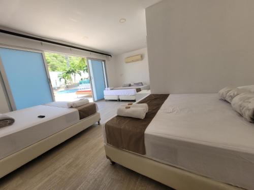 Imagen de la habitación del Hotel Med Taganga. Foto 16