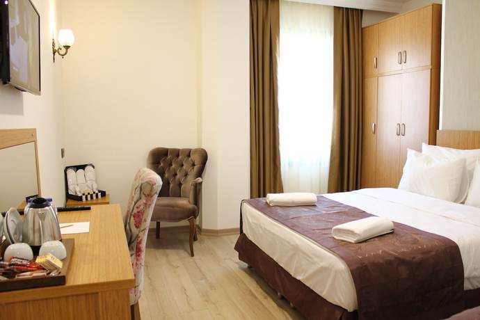 Imagen de la habitación del Hotel Melidium. Foto 15