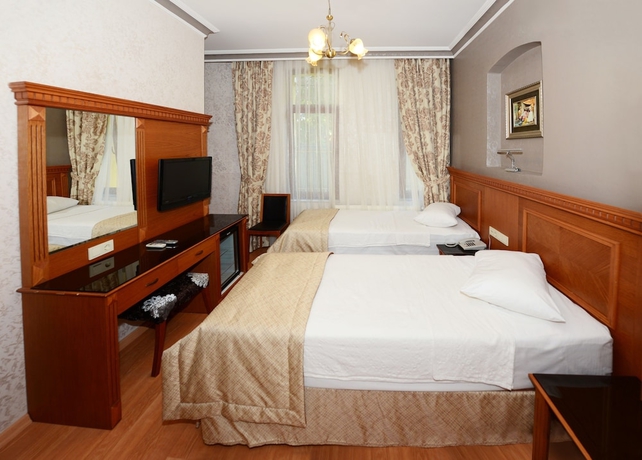 Imagen de la habitación del Hotel New House. Foto 5