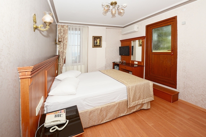 Imagen de la habitación del Hotel New House. Foto 11