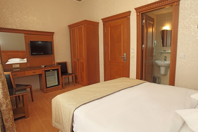 Imagen de la habitación del Hotel New House. Foto 12