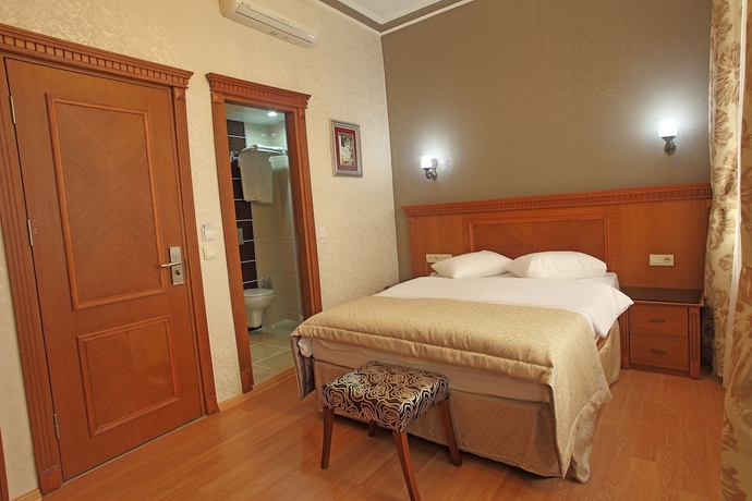 Imagen de la habitación del Hotel New House. Foto 13