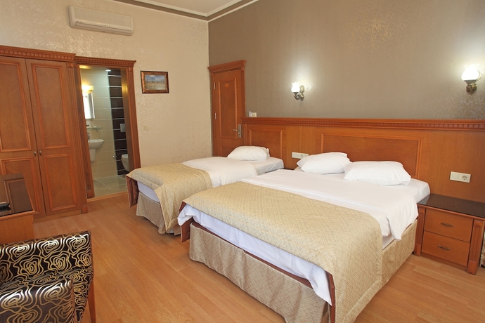 Imagen de la habitación del Hotel New House. Foto 14