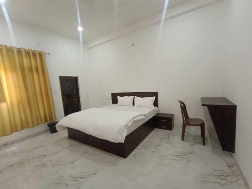 Imagen de la habitación del Hotel O Home Ayodhya Homestay. Foto 17
