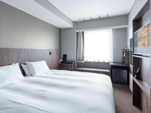 Imagen de la habitación del Hotel Odashima. Foto 16