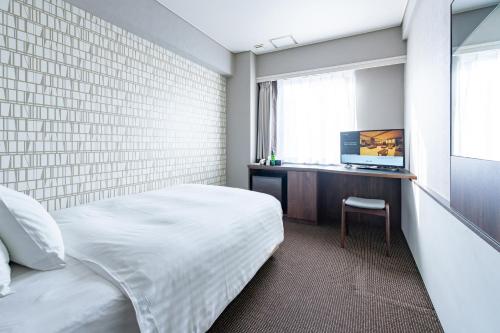Imagen de la habitación del Hotel Odashima. Foto 18