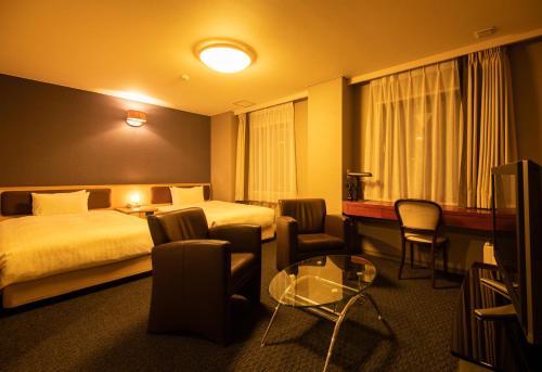 Imagen de la habitación del Hotel Odashima. Foto 19