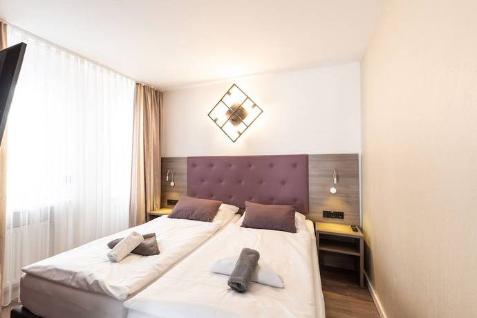 Imagen de la habitación del Hotel Porta Nigra. Foto 6