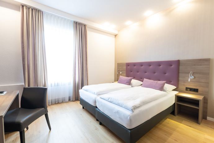 Imagen de la habitación del Hotel Porta Nigra. Foto 10