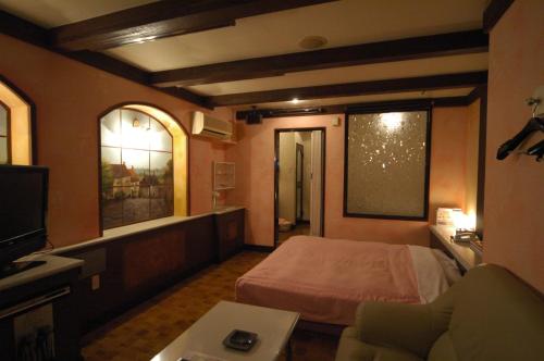 Imagen de la habitación del Hotel Remy (Adult Hotel). Foto 6