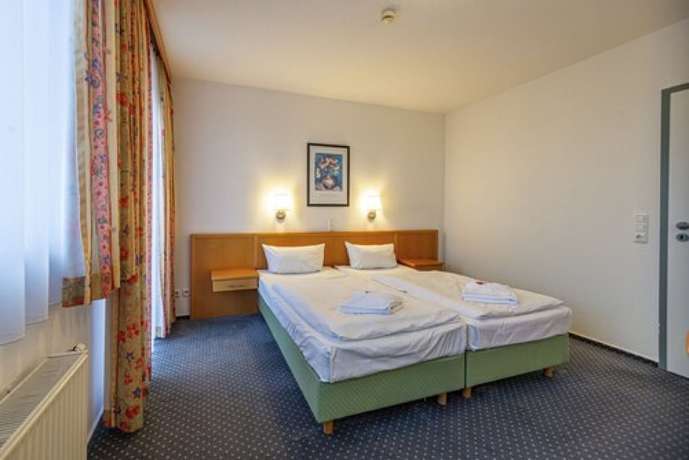 Imagen de la habitación del Hotel Rostock West im Kritzmow Park. Foto 10