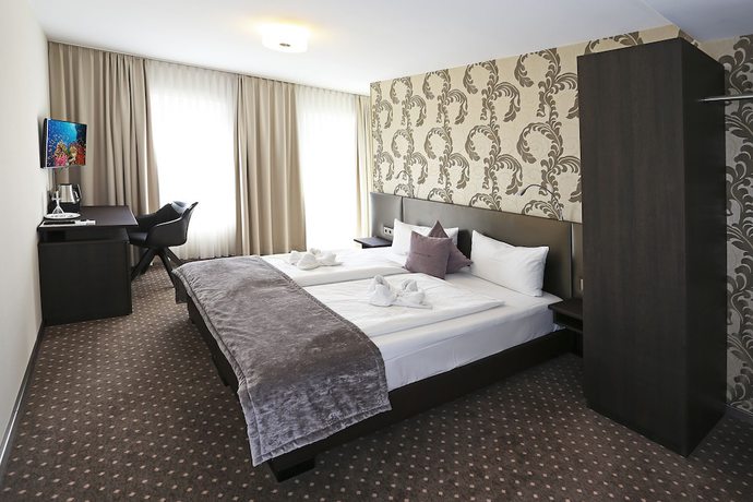 Imagen de la habitación del Hotel SONATA. Foto 12