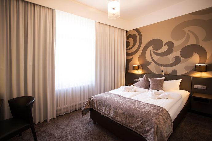 Imagen de la habitación del Hotel SONATA. Foto 19