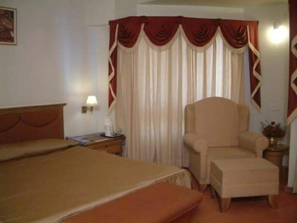 Imagen de la habitación del Hotel Sangat Regency. Foto 15