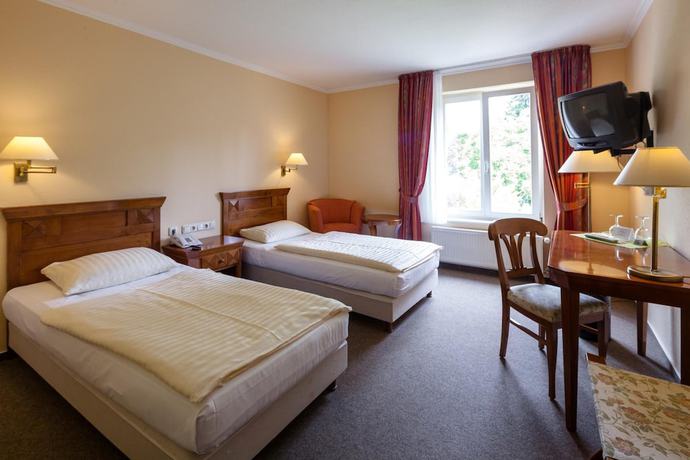 Imagen de la habitación del Hotel Schlossgarten. Foto 16