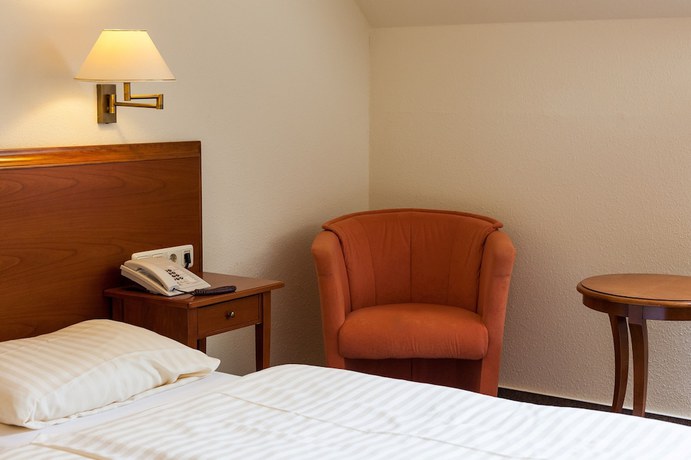 Imagen de la habitación del Hotel Schlossgarten. Foto 17