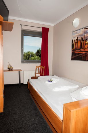 Imagen de la habitación del Hotel Sleepinger. Foto 10