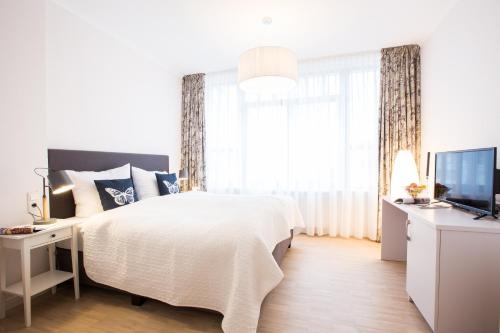 Imagen de la habitación del Hotel Strand26. Foto 7