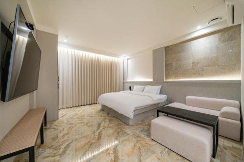 Imagen de la habitación del Hotel THE ART UIWANG. Foto 18