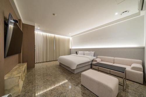 Imagen de la habitación del Hotel THE ART UIWANG. Foto 19