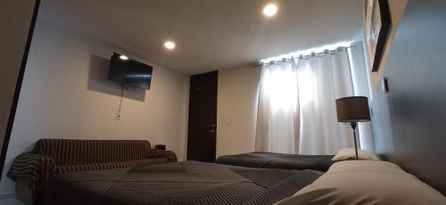 Imagen de la habitación del Hotel Tao. Foto 15