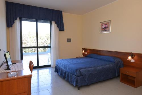 Imagen de la habitación del Hotel Villaggio Aurora. Foto 8
