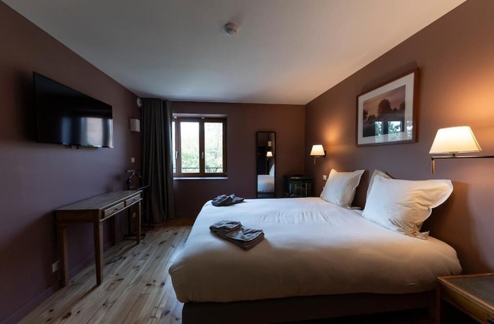 Imagen de la habitación del Hotel du Domaine Saint Loup. Foto 13