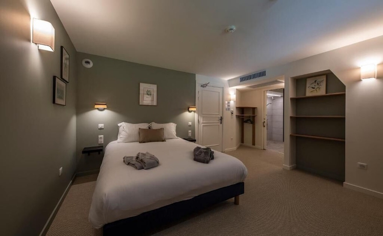 Imagen de la habitación del Hotel du Domaine Saint Loup. Foto 14