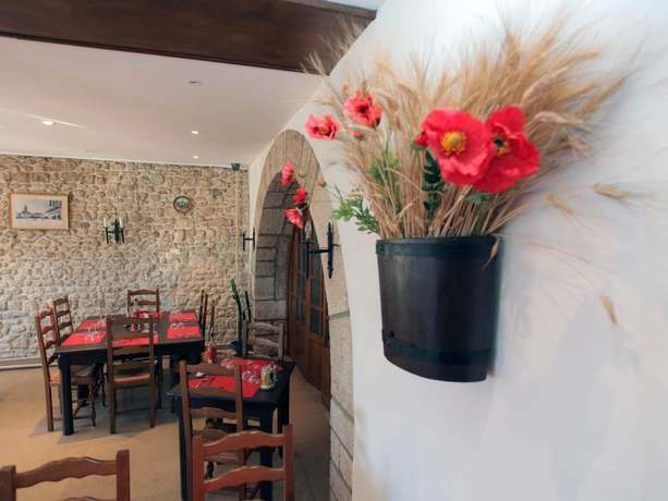 Imagen del bar/restaurante del Hotel le Chapeau Rouge. Foto 7