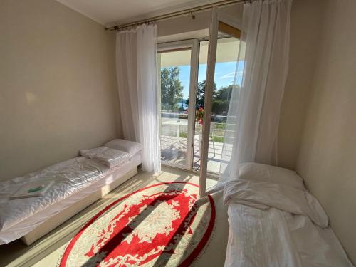 Imagen de la habitación del Hotelik Likusy - przy plaży nad jeziorem Ukiel z bezpłatnym prywatnym parkingiem i klimatyzacją. Foto 16