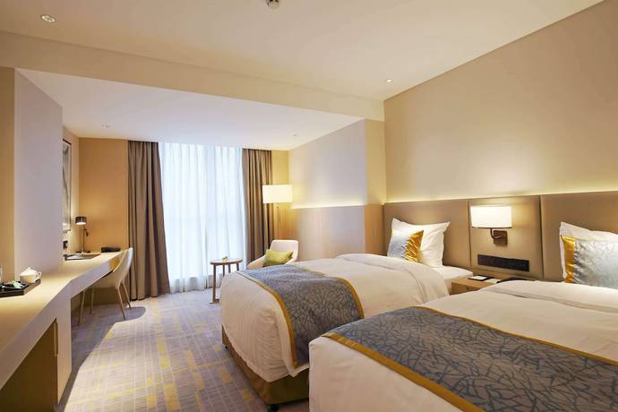 Imagen de la habitación del Howard Johnson By Wyndham Glory Plaza Chenghai. Foto 18