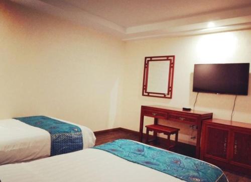 Imagen de la habitación del Huangshan Xinmengyuan Hotel. Foto 8