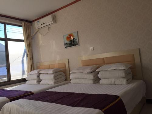 Imagen general del Huangyaguan Great Wall Li Bo Home Hotel. Foto 3